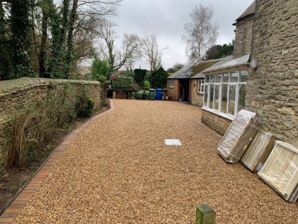 Gravel being laid on a driveway in Backwell