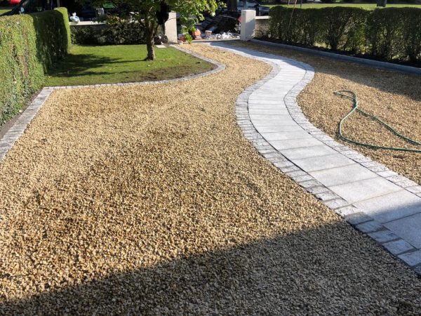 Gravel being laid on a driveway in Bagstone