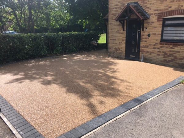 Resin with charcoal paved border in Avonmouth