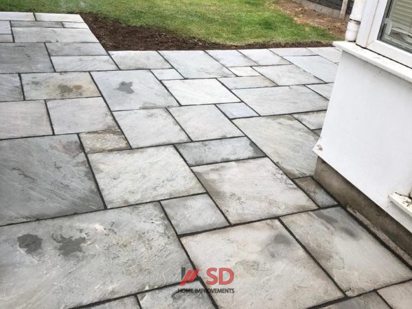 Smooth slabbed patio installation in Backwell