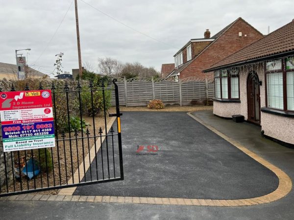 Tarmac with buff brick border in Bedminster