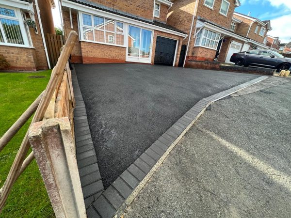 Tarmac with charcoal paving border in Avonmouth