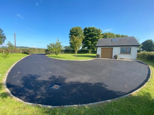 Tarmac with edging kerb border in Wickwar