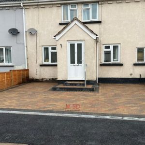 Driveway with Autumn Mix Block Paving and Dropped Kerb in…